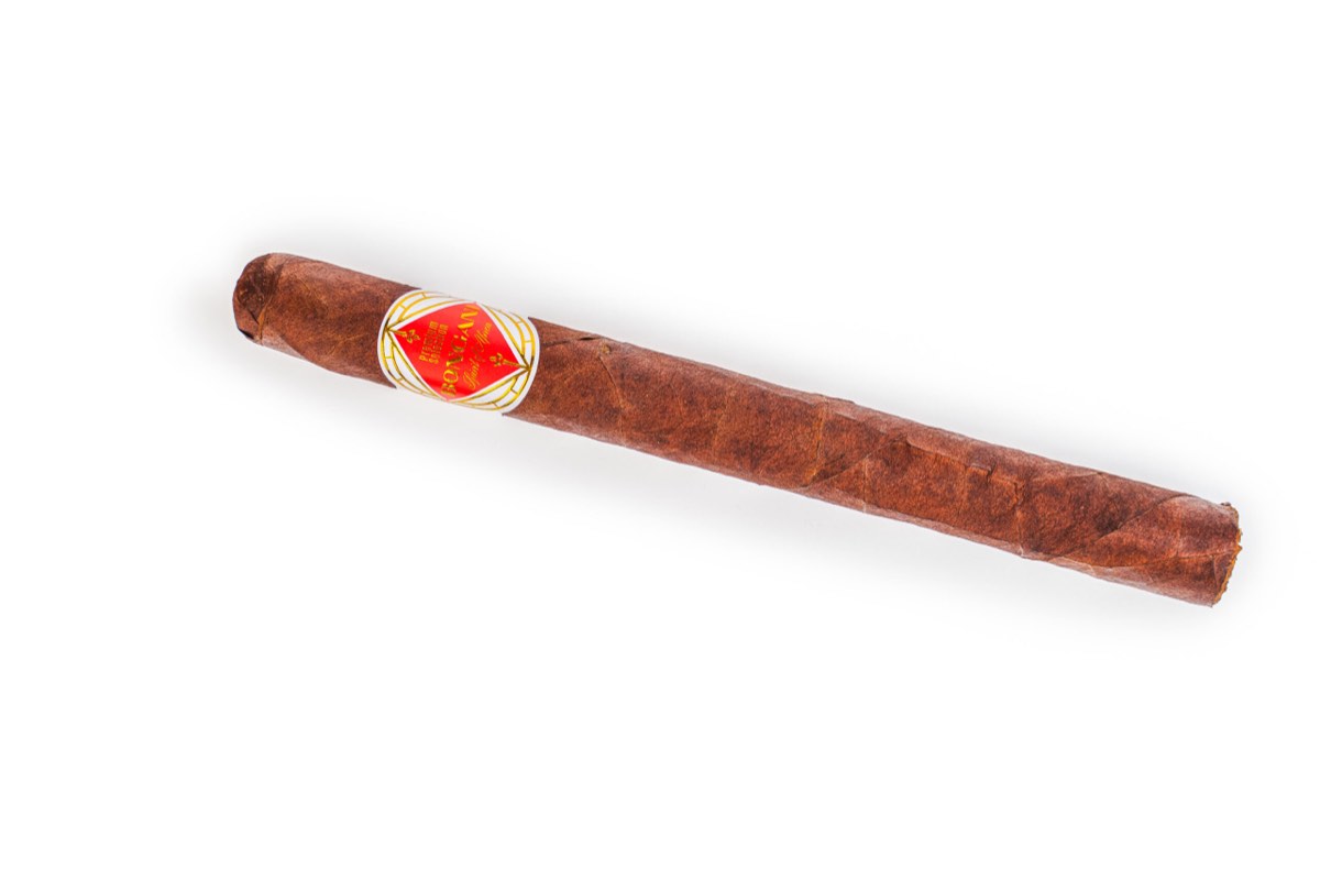 Handmade premium cigar size Lancero with white background