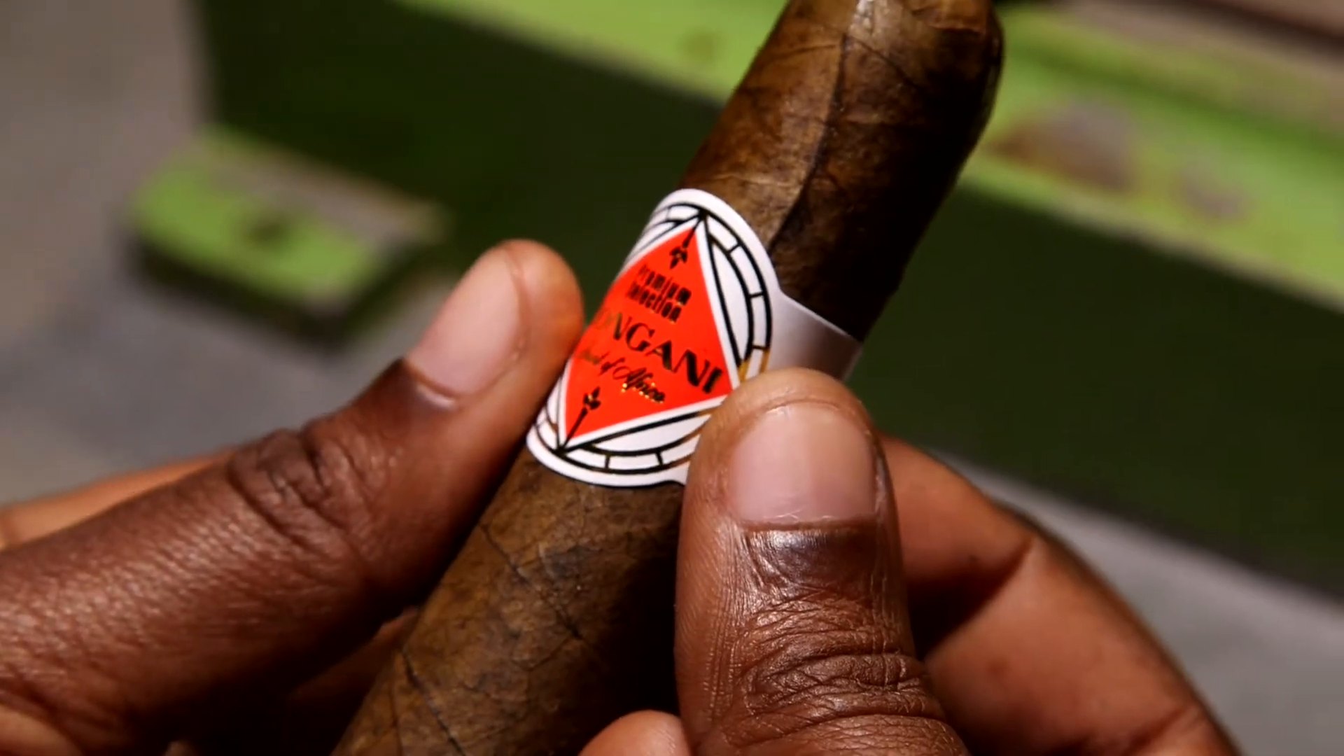 Holding a banded Bongani cigar